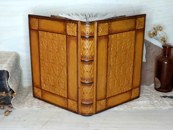 Antiqued yellow leather journal with tooled decoration. Romantic Sunset