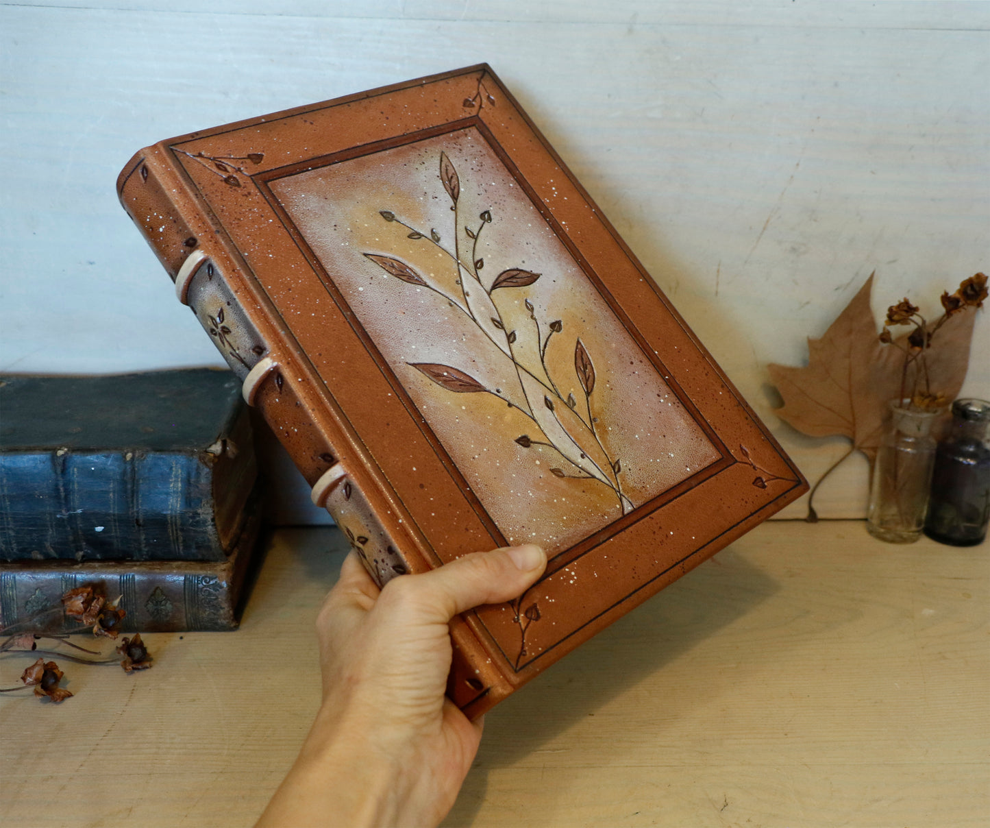 Brown leather journal with tooled floral decoration . Romantic Journey