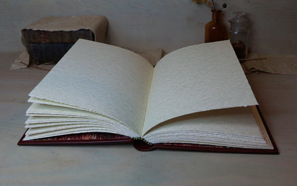 Antiqued red leather journal with cross decoration. One of a Kind - Faith