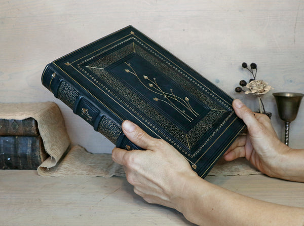 Dark Blue Leather Journal with gold floral decoration. The Midnight Garden