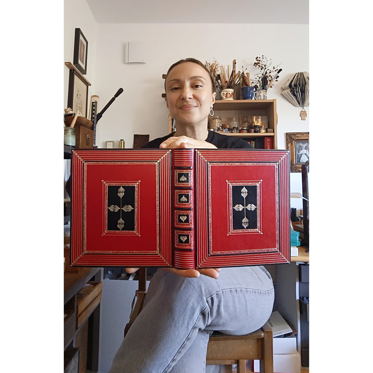 Bright red leather journal with black inlays and gold tooled decoration - The Gilded Labyrinth