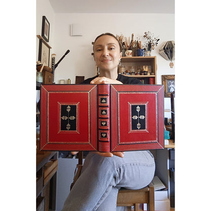 Bright red leather journal with black inlays and gold tooled decoration - The Gilded Labyrinth