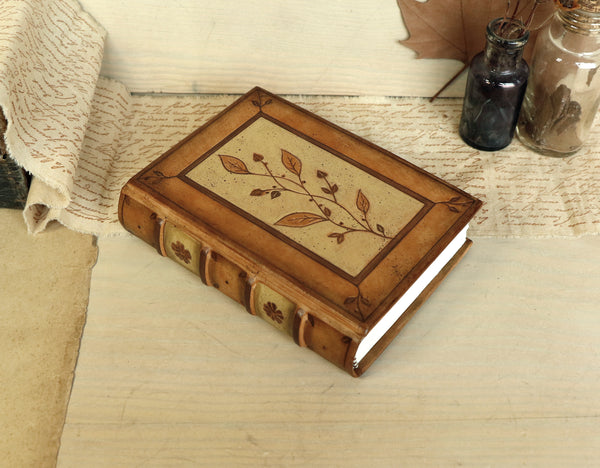 Brown leather journal with tooled floral decoration . Romantic Journey