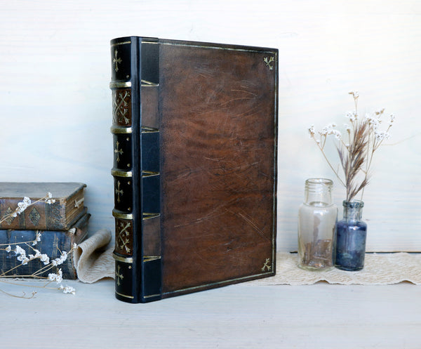 Large leather journal, Worn leather, Silver tooled decoration. The Old Book