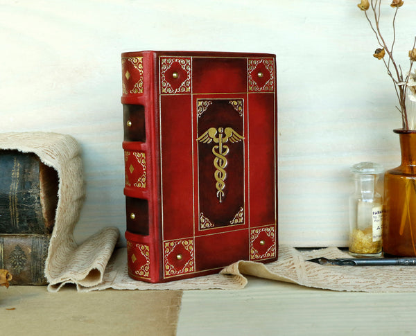 Red leather journal with gold decoration - The Caduceus