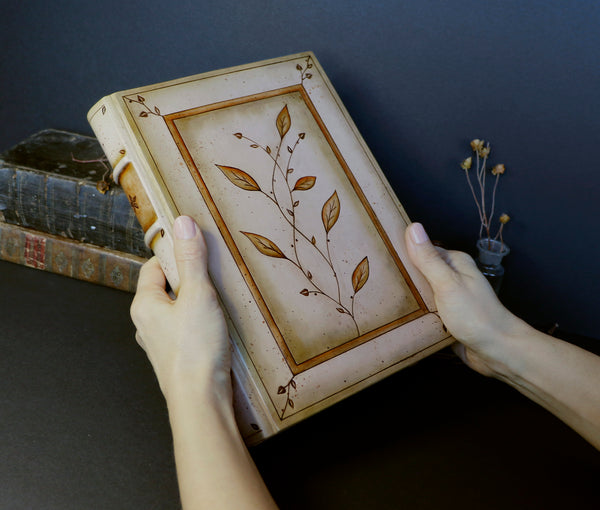Brown leather journal with tooled floral decoration . Romantic Journey