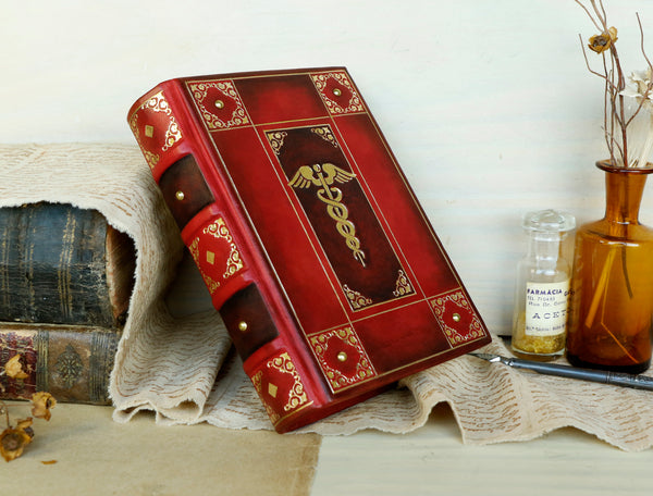 Red leather journal with gold decoration - The Caduceus