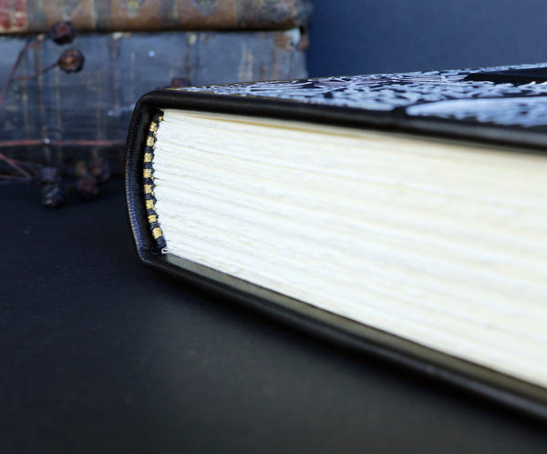 Black leather journal with Hand drawn white and gold foil decoration,