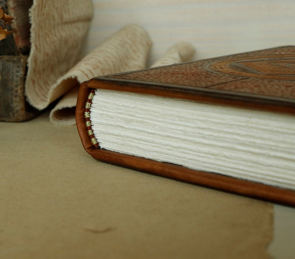 Brown leather journal with blind tooled decoration -  The Eye of the Universe