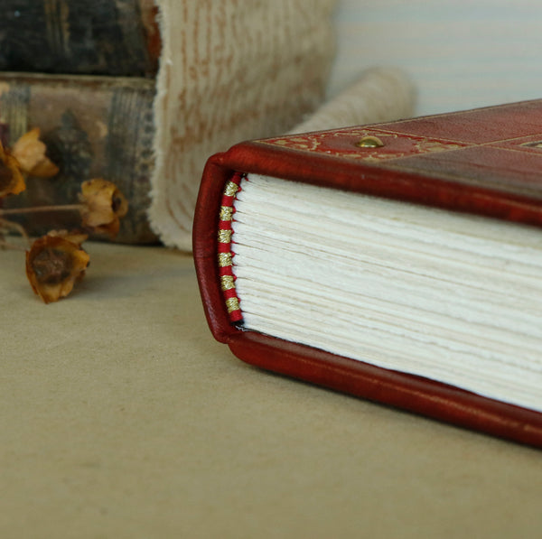 Red leather journal with gold decoration - The Caduceus