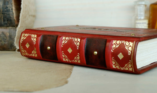 Red leather journal with gold decoration - The Caduceus