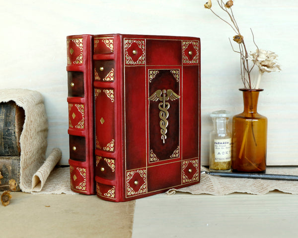 Red leather journal with gold decoration - The Caduceus