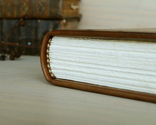 Brown leather journal with tooled decoration, The Circle of Time