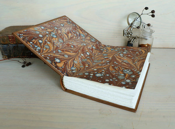 Brown leather journal with tooled decoration, The Circle of Time