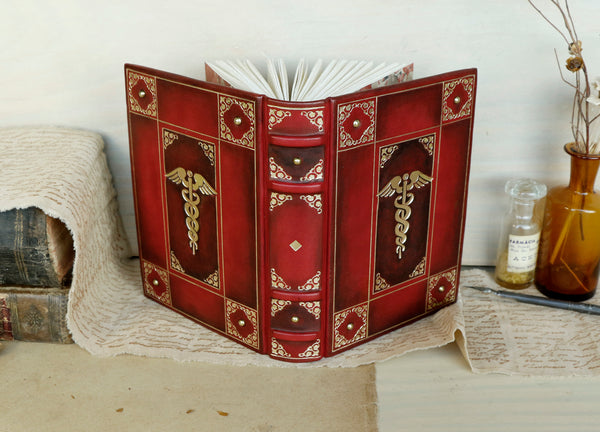 Red leather journal with gold decoration - The Caduceus